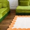 Modern Green Sofa Set with Decorative Flower Vases - Image 3